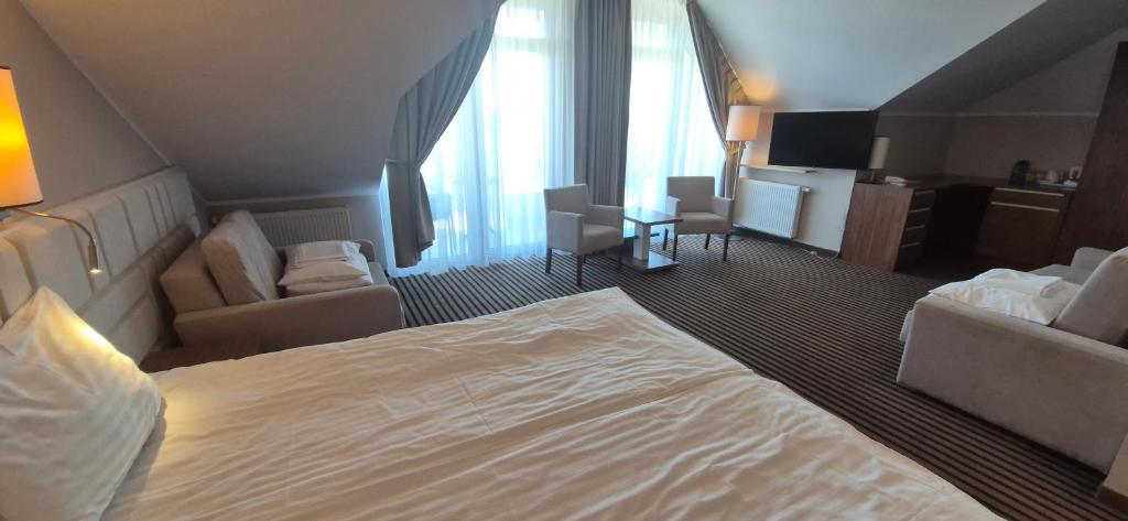 Postel nebo postele na pokoji v ubytování Hotel White