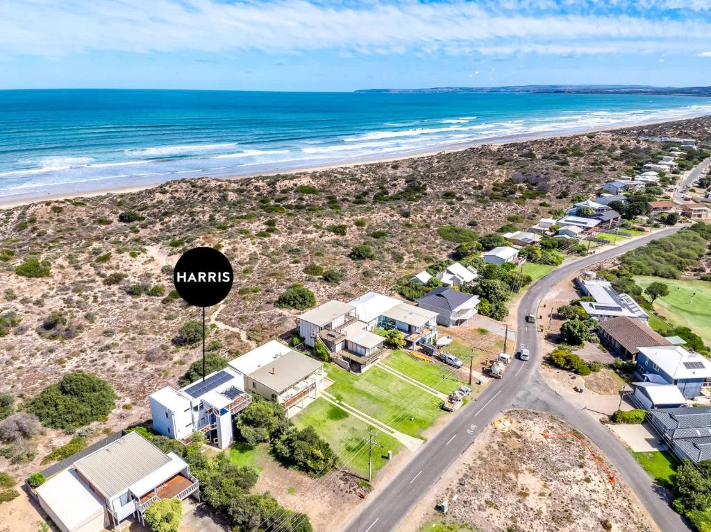 an aerial view of a beach with houses and the ocean at 61 Bristow-Smith Avenue Goolwa South - Linen Included in Goolwa South