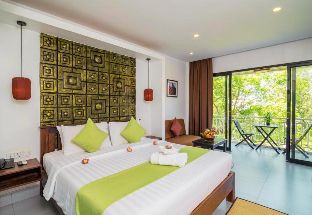 Postel nebo postele na pokoji v ubytování Angkor Home 27