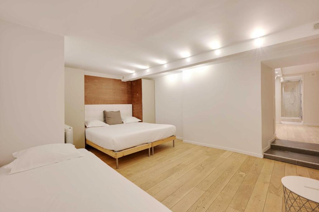 Posteľ alebo postele v izbe v ubytovaní Spacious apartment - 4BR-15P - Sentier-Grand Rex