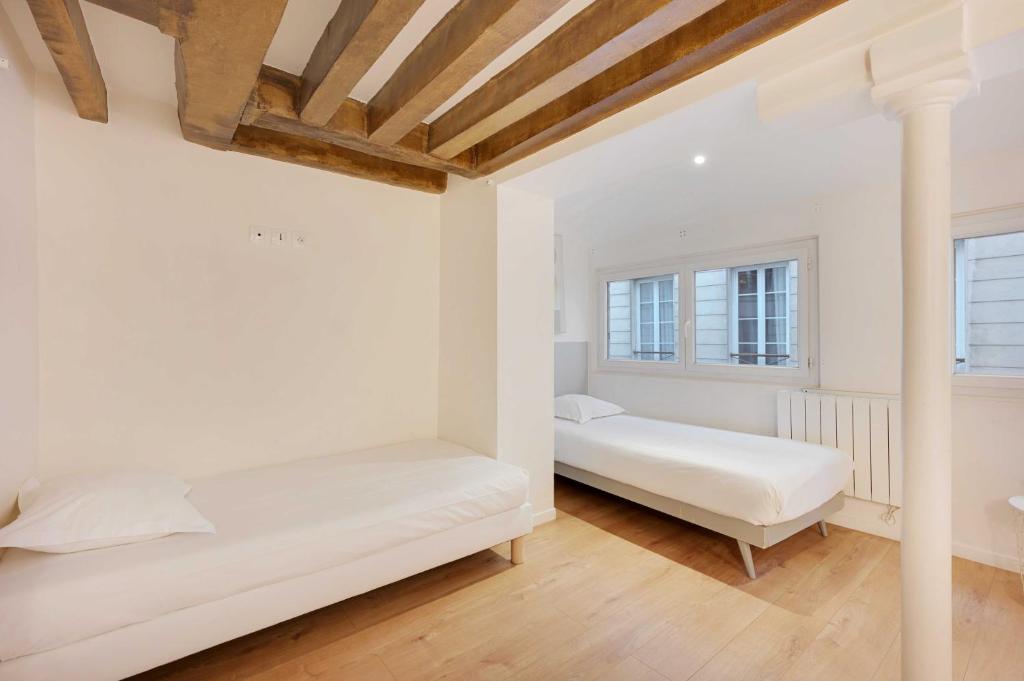 Posteľ alebo postele v izbe v ubytovaní Spacious apartment - 4BR-15P - Sentier-Grand Rex