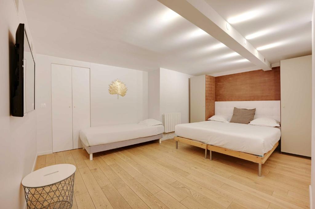 Posteľ alebo postele v izbe v ubytovaní Spacious apartment - 4BR-15P - Sentier-Grand Rex