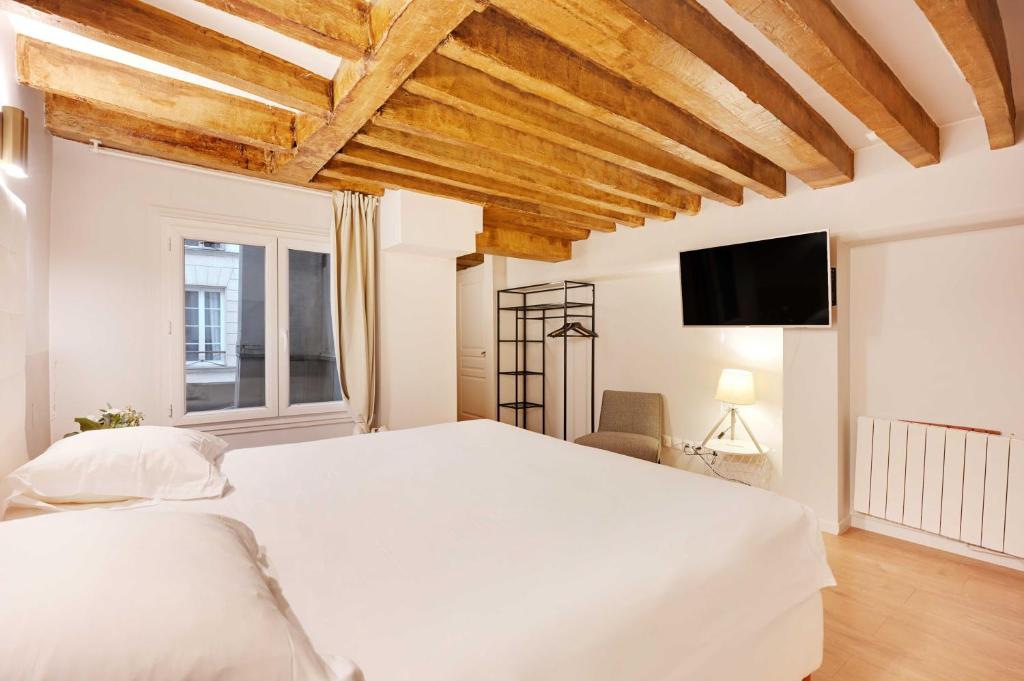 Posteľ alebo postele v izbe v ubytovaní Spacious apartment - 4BR-15P - Sentier-Grand Rex