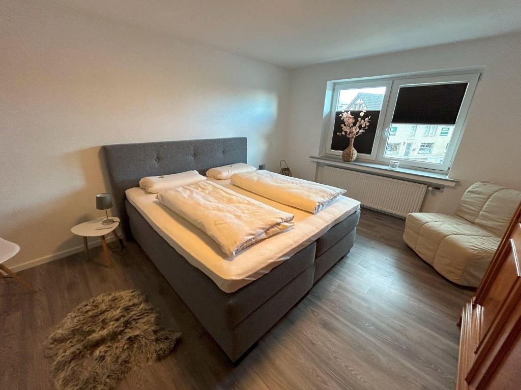 Postel nebo postele na pokoji v ubytování Kragemann Hotel & Vinothek
