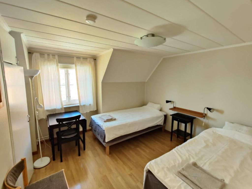 Postel nebo postele na pokoji v ubytování Wisby Trossen 4 AB