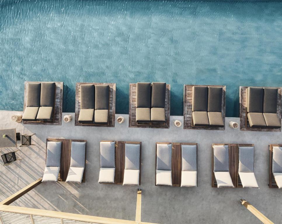 Posezení v ubytování Magma Resort Santorini, In The Unbound Collection By Hyatt