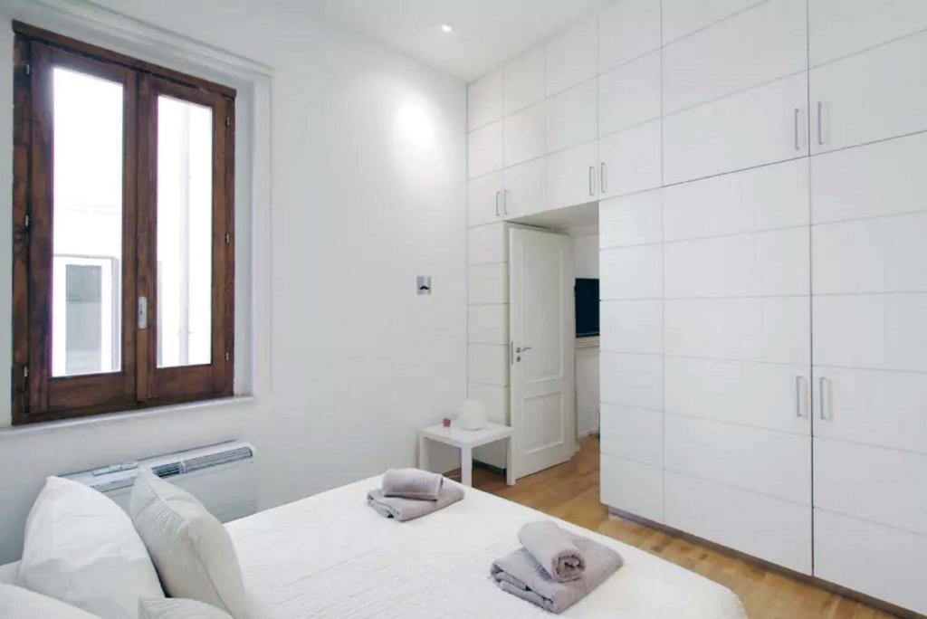 A bed or beds in a room at Navona Secret Suite