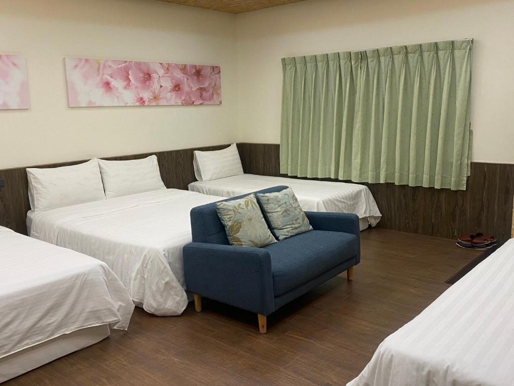 Postel nebo postele na pokoji v ubytování Chin Shue B&B