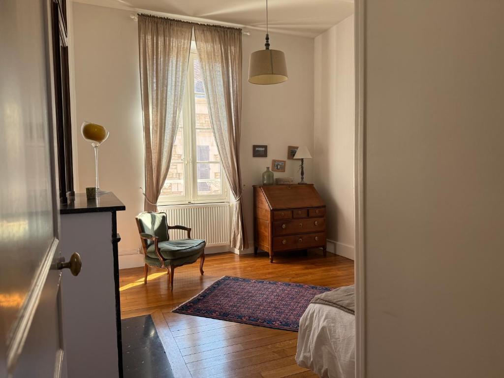 Postel nebo postele na pokoji v ubytování Maison des 7 lieux