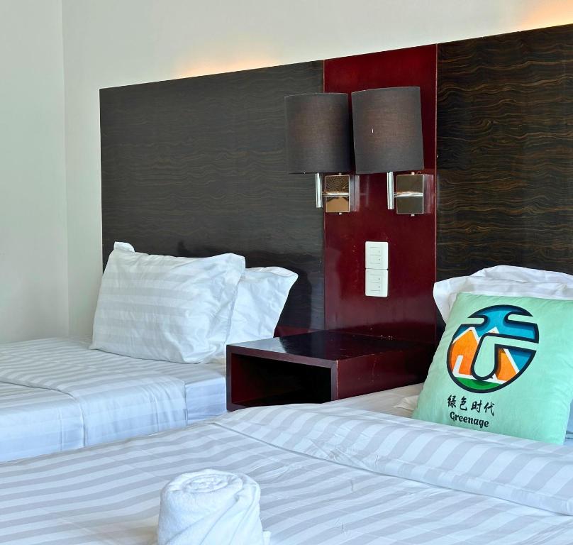 Letto o letti in una camera di Ming Greenage Suite 明绿时代套房 @Kota Kinabalu 亚庇市中心