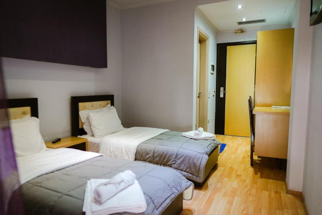 Postel nebo postele na pokoji v ubytování Hotel Shehu