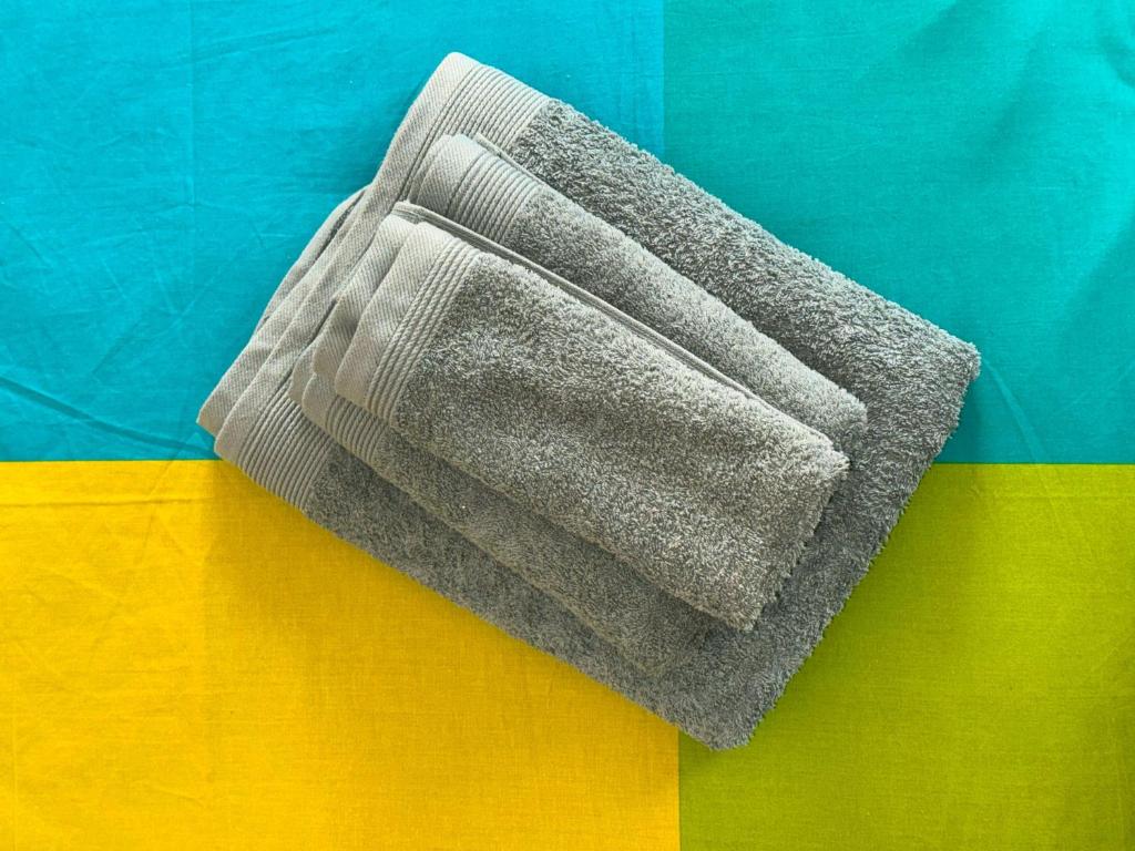 a sock on top of a colorful blanket at Casa Mariuccia in Ponzone