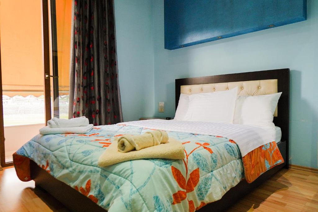 Postel nebo postele na pokoji v ubytování Hotel Shehu