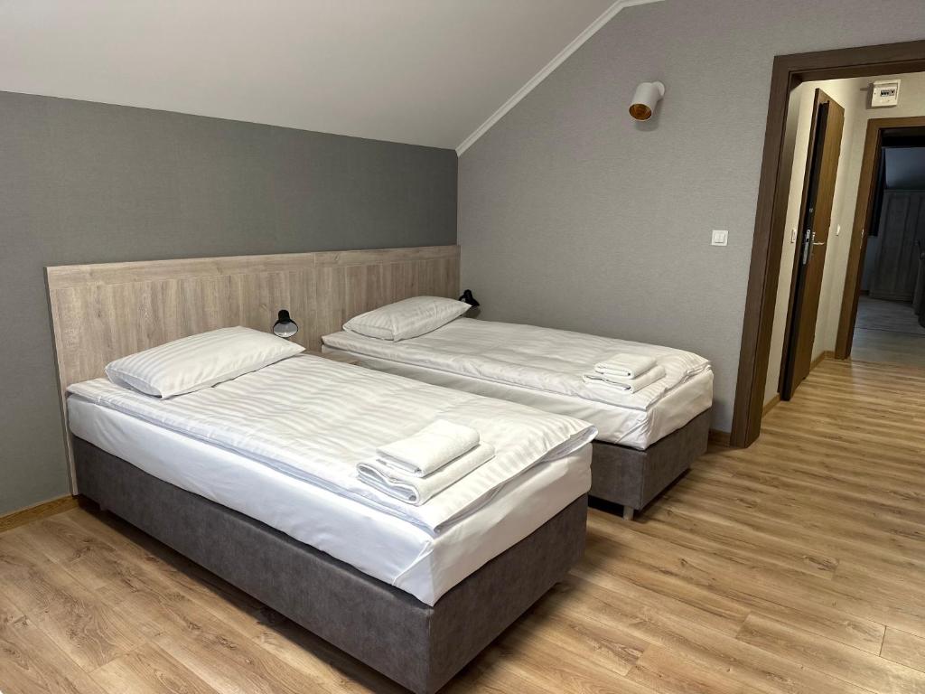 Postel nebo postele na pokoji v ubytování Karczma u Jakuba