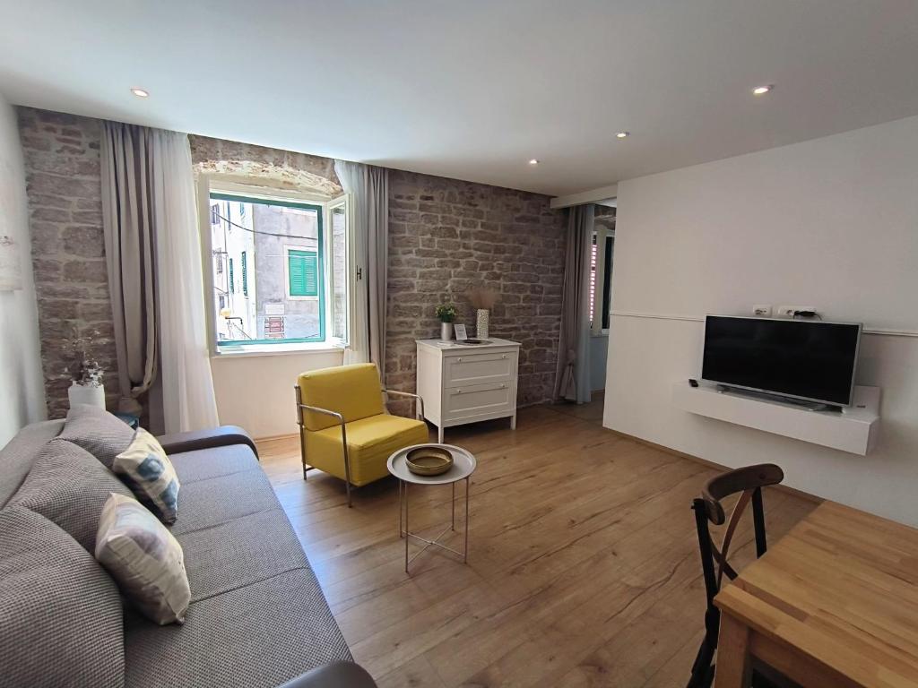 Televízia a/alebo spoločenská miestnosť v ubytovaní Rialto Luxury Apartment