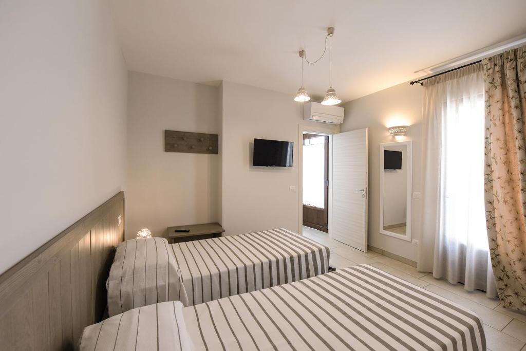 A bed or beds in a room at Terra Mater - Exclusive Cottage -