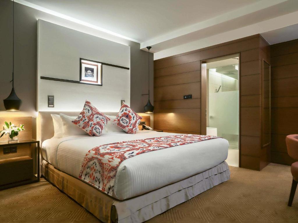 Postel nebo postele na pokoji v ubytování Movenpick Hotel & Convention Centre KLIA