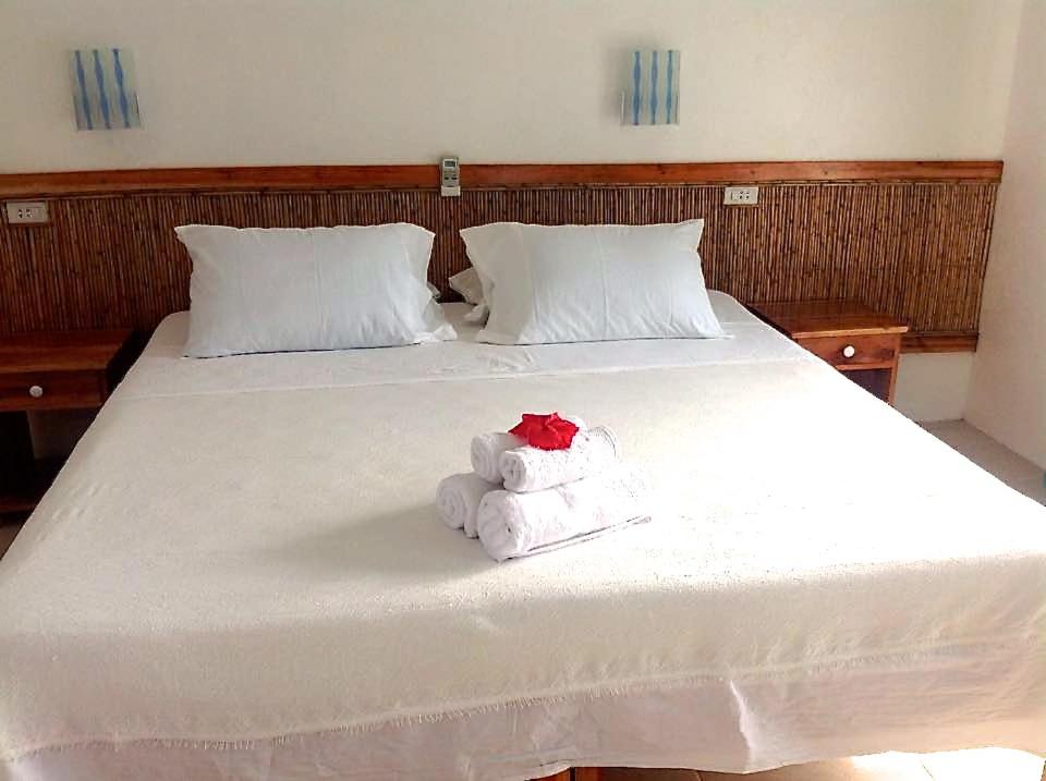 Postel nebo postele na pokoji v ubytování Lanterna Hotel Boracay