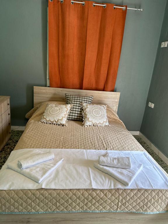 Postel nebo postele na pokoji v ubytování ZeusPlace Akti Platamonas