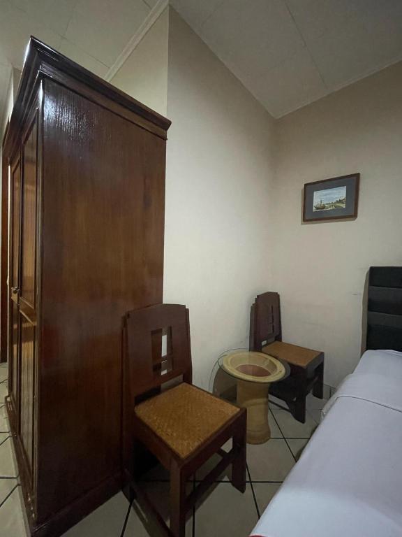 Postel nebo postele na pokoji v ubytování RedDoorz Plus near Parahyangan University