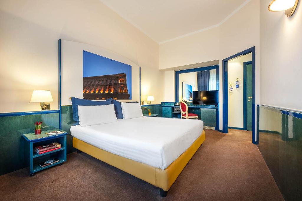 Postel nebo postele na pokoji v ubytování iH Hotels Milano Ambasciatori