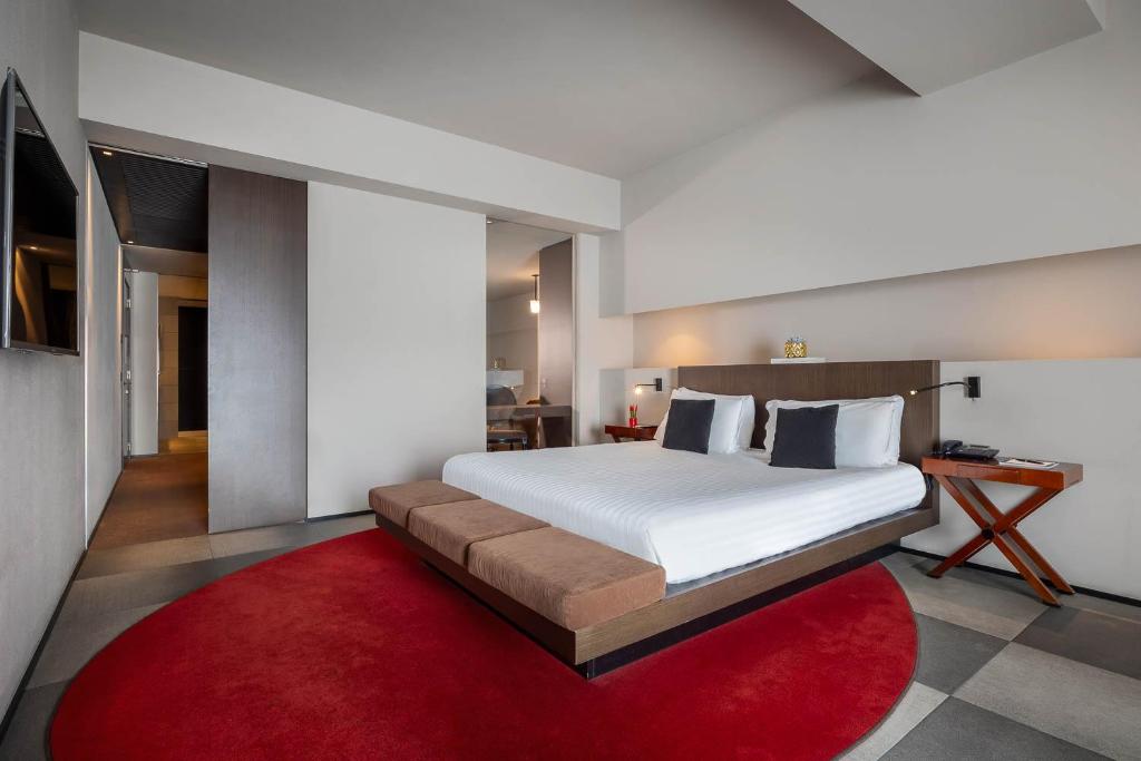 Postel nebo postele na pokoji v ubytování iH Hotels Milano Ambasciatori