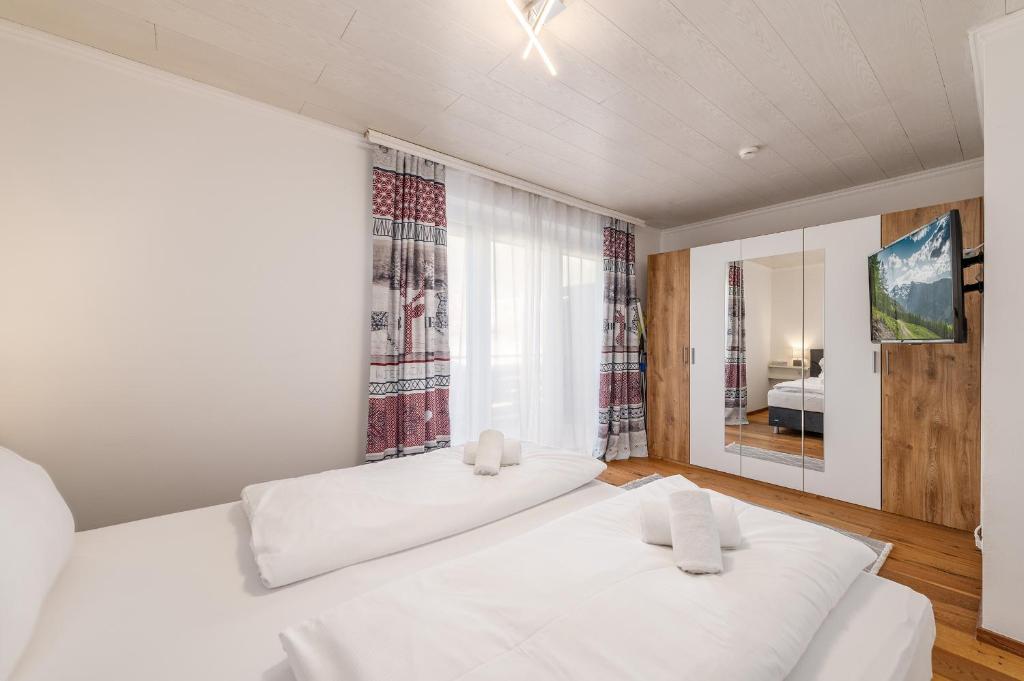 Postel nebo postele na pokoji v ubytování StoderGarden Apartment - by myNests