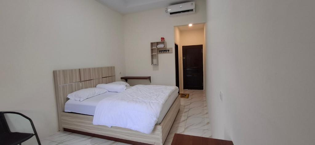 Postel nebo postele na pokoji v ubytování Homestay Sa'adah