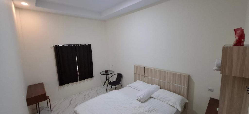 Postel nebo postele na pokoji v ubytování Homestay Sa'adah
