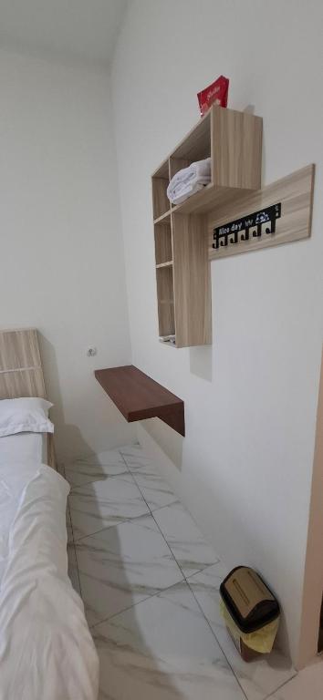 Postel nebo postele na pokoji v ubytování Homestay Sa'adah