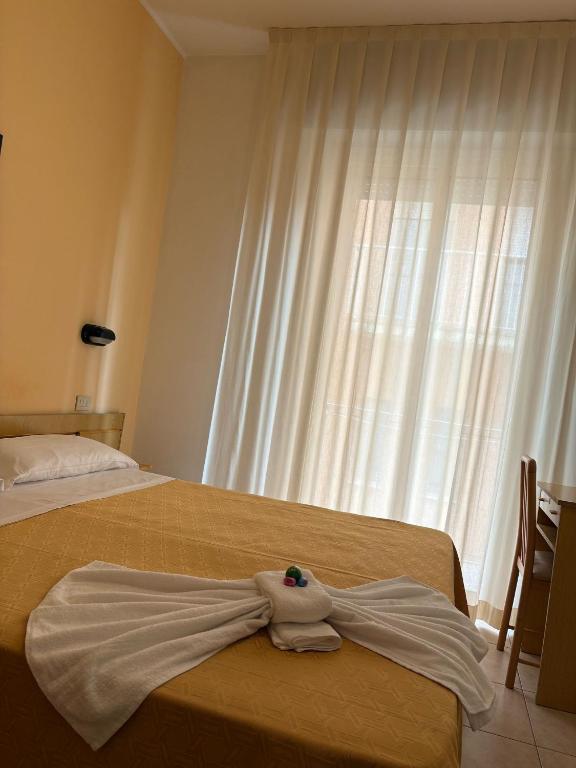 Postel nebo postele na pokoji v ubytování Hotel Sport