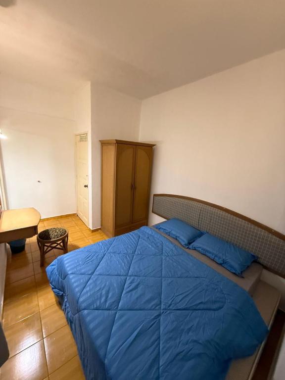 Postel nebo postele na pokoji v ubytování Glory Beach SeaView 3BR RamsHomestay