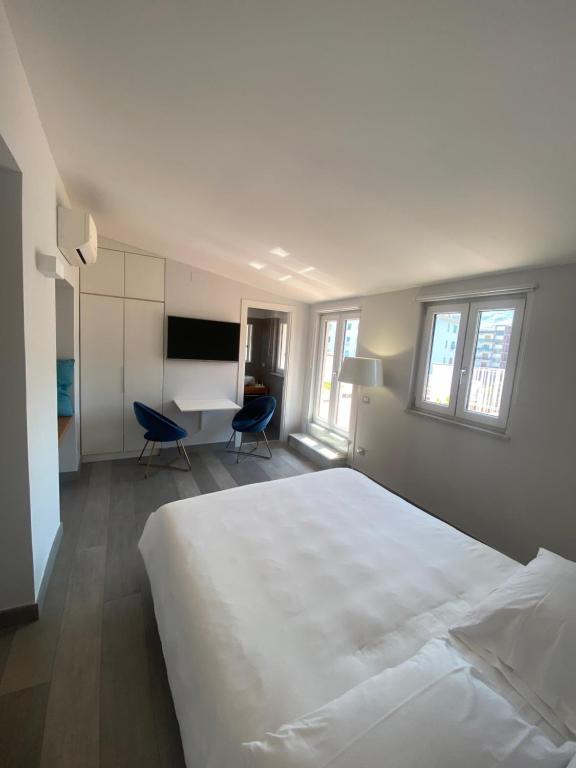 Postel nebo postele na pokoji v ubytování B&B Unique