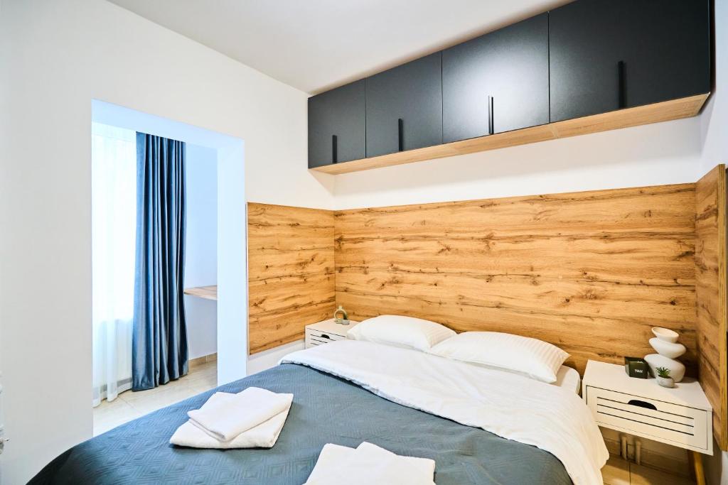 Ένα ή περισσότερα κρεβάτια σε δωμάτιο στο Botanical garden and Airport Studio Combo