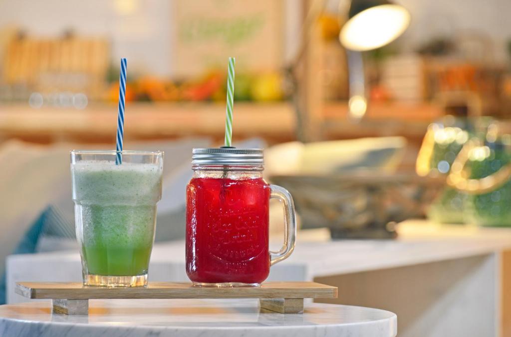 two drinks in mason jars sitting on a table at INNSiDE by Meliá Fuerteventura – Adults Only in Costa Calma