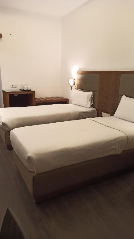 Postel nebo postele na pokoji v ubytování Mountain Retreat Kodai
