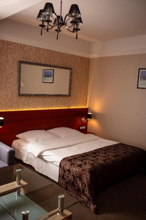 Postel nebo postele na pokoji v ubytování Hotel&Spa Kameleon