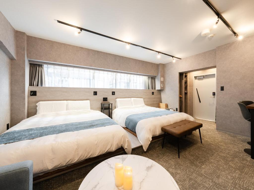 Voodi või voodid majutusasutuse Akihabara Sta 13min, Kanda Sta 10min,Ogawamachi 2min,Hotel Prime Inn Kanda, toas