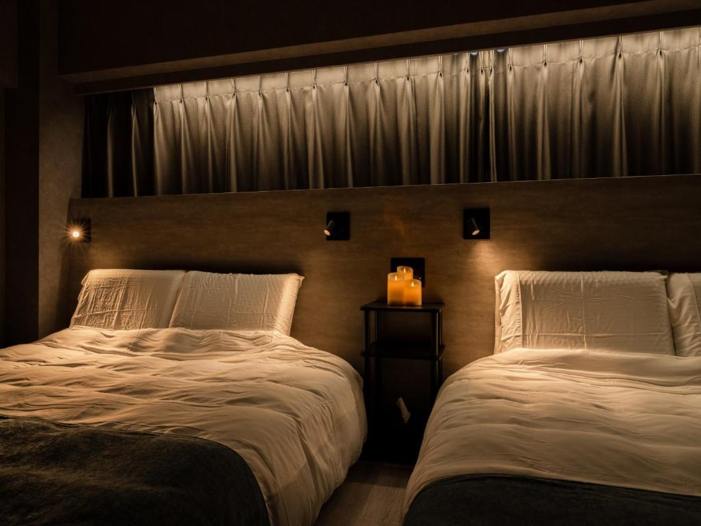 Voodi või voodid majutusasutuse Akihabara Sta 13min, Kanda Sta 10min,Ogawamachi 2min,Hotel Prime Inn Kanda, toas