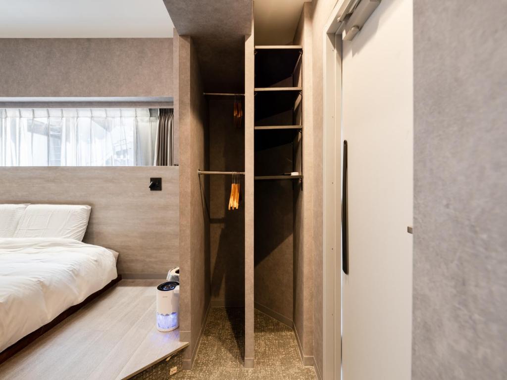 Voodi või voodid majutusasutuse Akihabara Sta 13min, Kanda Sta 10min,Ogawamachi 2min,Hotel Prime Inn Kanda, toas