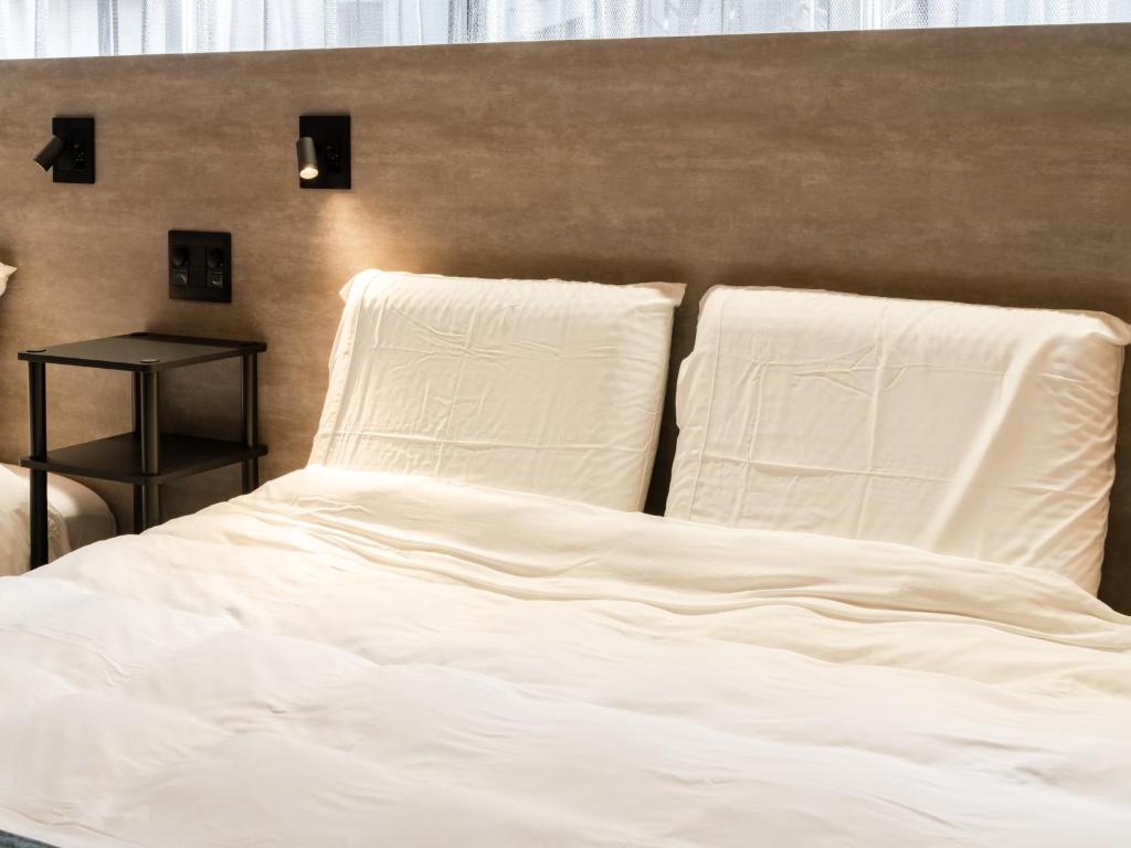 Voodi või voodid majutusasutuse Akihabara Sta 13min, Kanda Sta 10min,Ogawamachi 2min,Hotel Prime Inn Kanda, toas