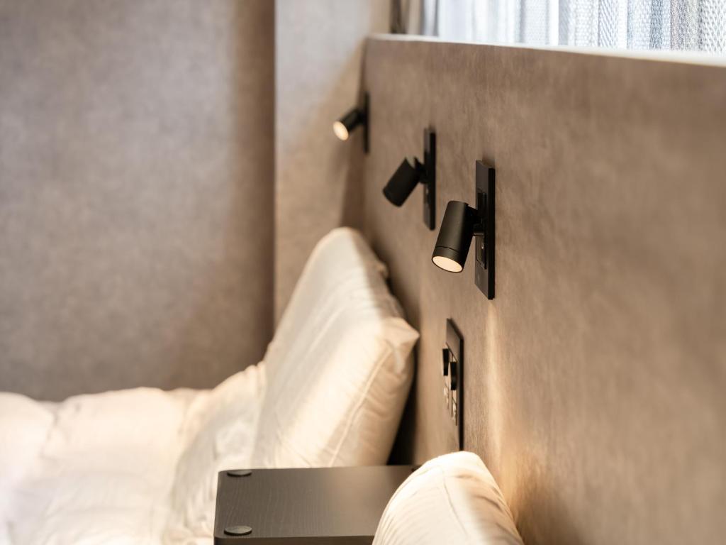 Voodi või voodid majutusasutuse Akihabara Sta 13min, Kanda Sta 10min,Ogawamachi 2min,Hotel Prime Inn Kanda, toas