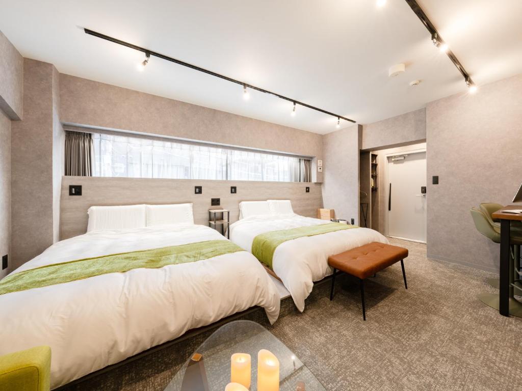 Voodi või voodid majutusasutuse Akihabara Sta 13min, Kanda Sta 10min,Ogawamachi 2min,Hotel Prime Inn Kanda, toas