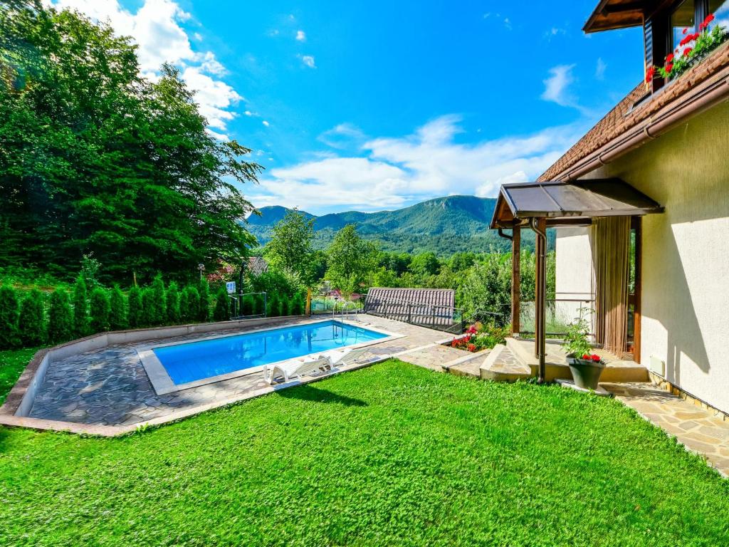 a swimming pool in the yard of a house at Holiday Home Božica by Interhome in Brod na Kupi