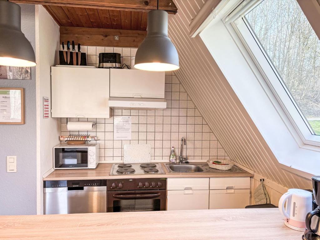 Kuchyň nebo kuchyňský kout v ubytování Chalet Waldrauschen by Interhome