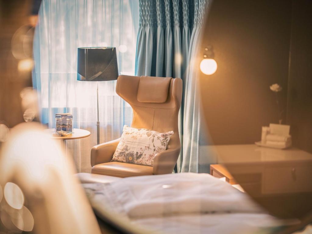 Postel nebo postele na pokoji v ubytování Resort Hof Weissbad