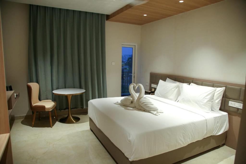 Postel nebo postele na pokoji v ubytování Leaf Hotel
