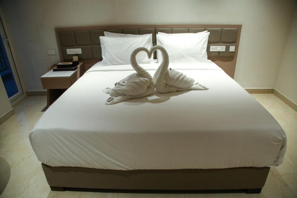 Postel nebo postele na pokoji v ubytování Leaf Hotel