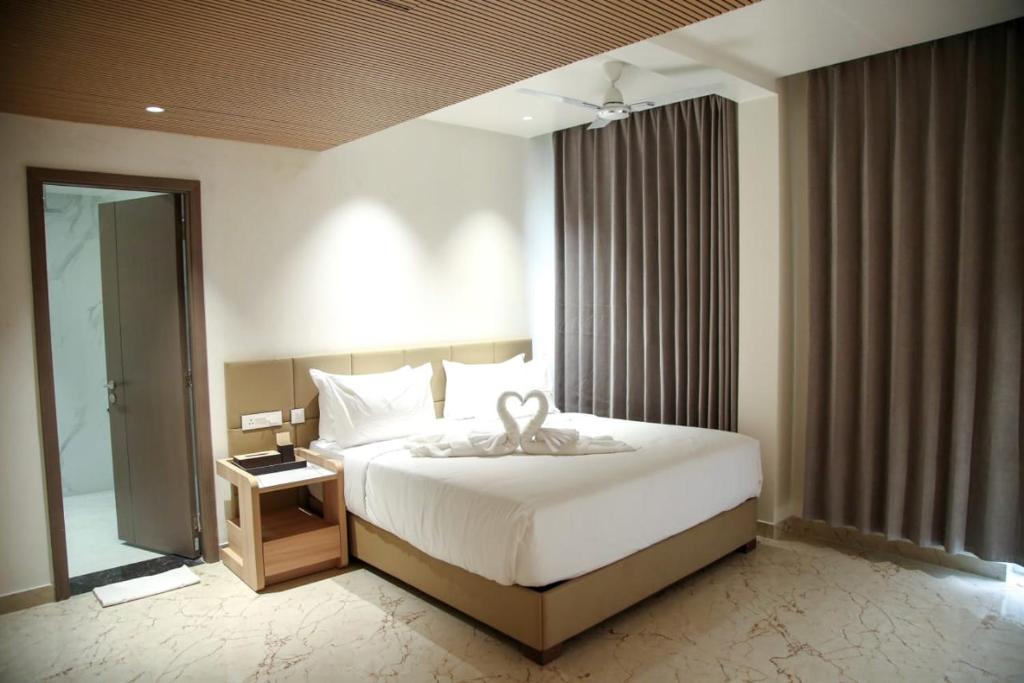 Postel nebo postele na pokoji v ubytování Leaf Hotel