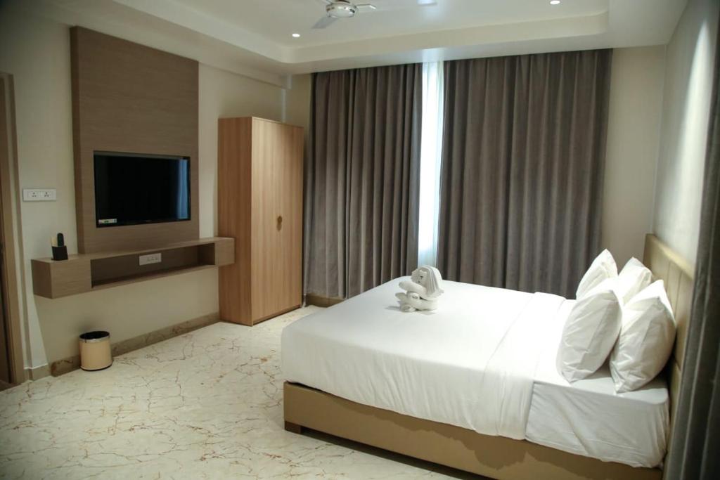 Postel nebo postele na pokoji v ubytování Leaf Hotel